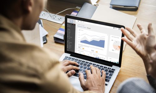 People working on a laptop in a meeting